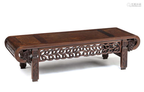 A CARVED HARDWOOD LOW TABLE