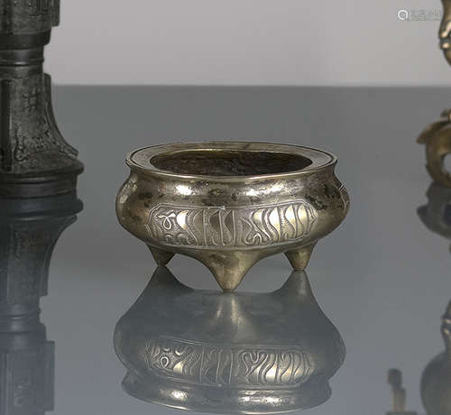 A BRONZE CENSER WITH ARABIC INSCRIPTION AND GOLD-SPLASHES