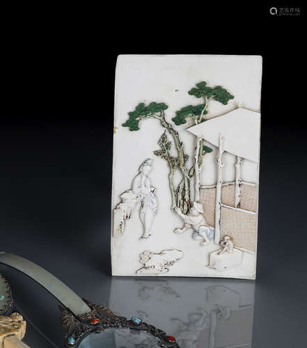 A FINE CARVED AND PAINTED IVORY PANEL WITH A FIGURAL SCENE FOR A TABLE SCREEN