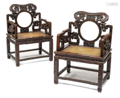 A PAIR OF CARVED HARDWOOD CHAIRS