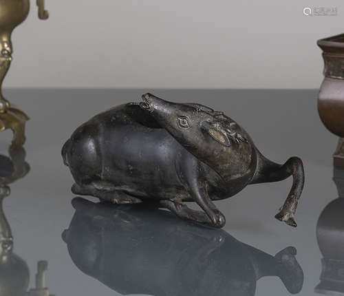 A RECUMBENT BRONZE DEER AS CENSER