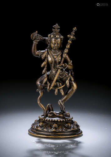 A  SILVER- AND COPPER-INLAID BRONZE FIGURE OF VAJRAVARAHI