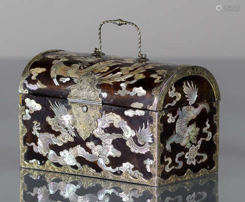 A MOTHER-OF-PEARL-INLAID TRUNK-SHAPED LACQUERED BOY AND COVER WITH SILVER FITTINGS