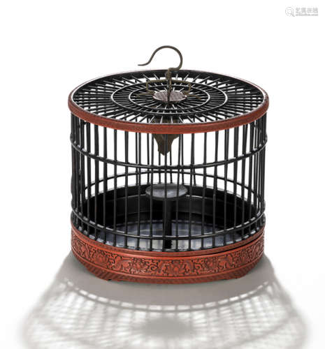 A WOOD AND CINNABAR LACQUER BIRD CAGE