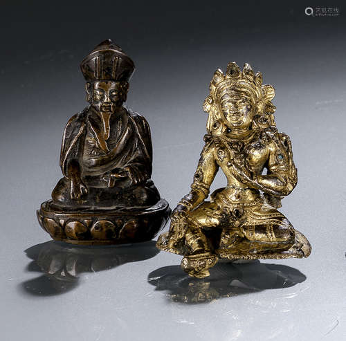 A GILT-BRONZE FIGURE OF SYAMATARA AND A BRONZE FIGURE OF A LAMA