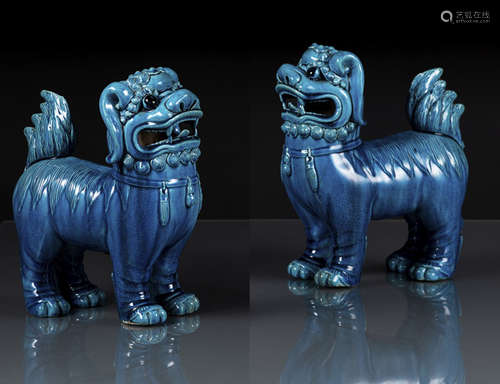 A PAIR OF TURQUOISE-GLAZED BISCUIT PORCELAIN LIONS