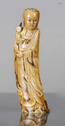 A WELL CARVED IVORY MODEL OF GUANYIN AND BOY