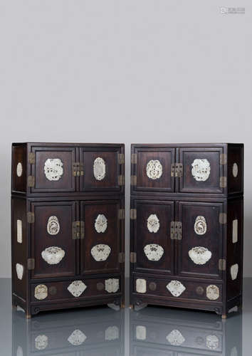 A PAIR OF HARDWOOD CABINETS WITH 29 DECORATED JADE CARVINGS