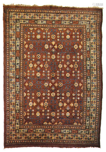 A KHOTAN CARPET WITH BLOSSOM DESIGN