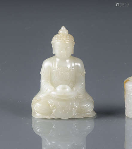 A LIGHT GREEN JADE CARVING OF SEATED BUDDHA AMITHABA WITH A BOWL