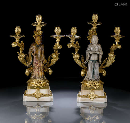 A FINE AND LARGE PAIR OF FRENCH ORMOLU CANDLE HOLDERS WITH CHINESE CARVED SOAPSTONE FIGURES