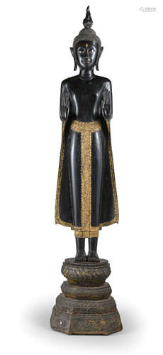 A GILT- AND BLACK-LACQUERED WOOD FIGURE OF BUDDHA SHAKYAMUNI THAILAND