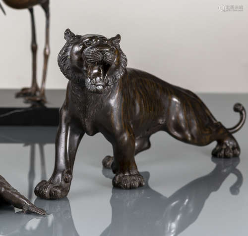 A BRONZE MODEL OF A ROARING TIGER