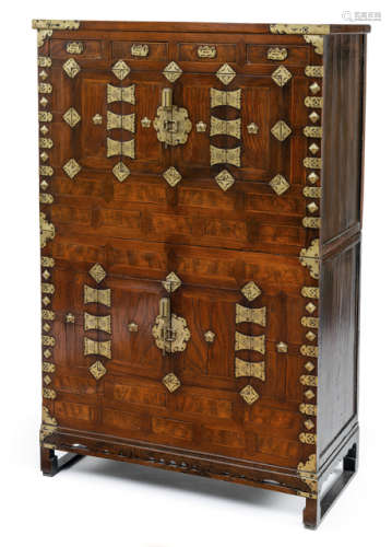 A TWO-PART WOODEN CABINET WITH METAL FITTINGS