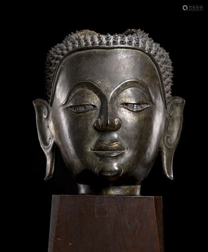 A BRONZE HEAD OF BUDDHA SHAKYAMUNI