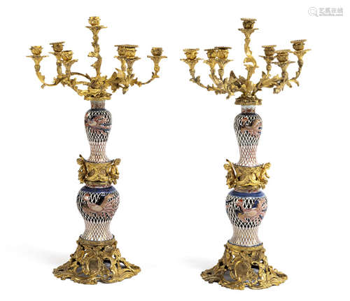 A LARGE PAIR OF ORMOLU CANDLEHOLDERS WITH ARITA PORCELAIN VASES