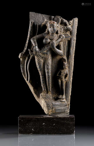 A BLACK STONE FIGURE OF SARASVATI