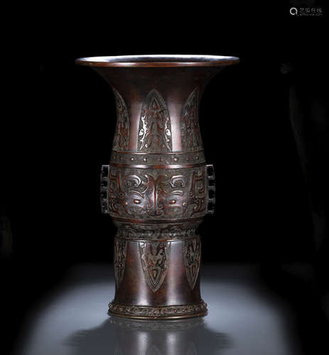 A LARGE GU-SHAPED BRONZE VASE IN ARCHAIC STYLE