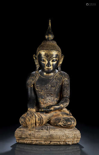 A GILT- AND BLACK-LACQUERED WOOD FIGURE OF BUDDHA SHAKYAMUNI