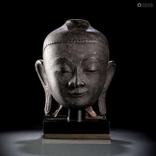 A BLACK-LACQUERED PAPIER MACHE HEAD OF BUDDHA SHAKYAMUNI