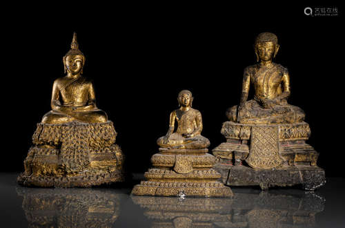 THREE GILT- AND BLACK-LACQUERED BRONZE FIGURES OF BUDDHA SHAKYAMUNI