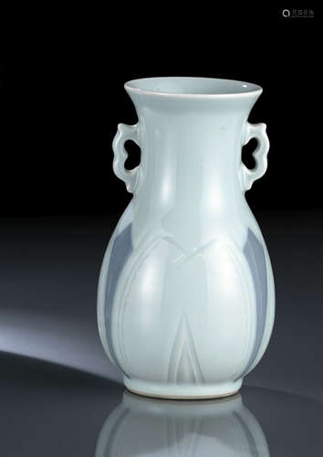 A SKY-BLUE GLAZED PORCELAIN VASE WITH ENGRAVED ABSTRACT PATTERNS