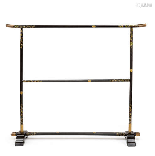 A BLACK-LACQUERED CLOTHES RACK