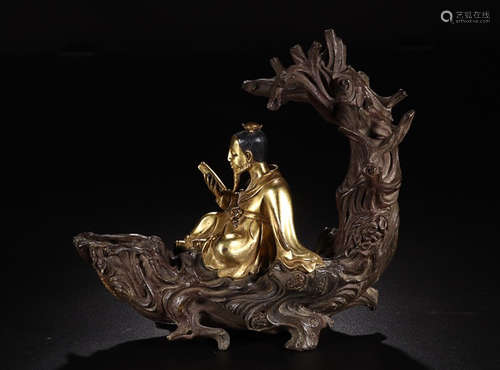 A GILT BRONZE CELESTIAL BEING