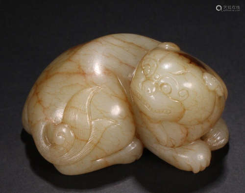 A HETIAN JADE AUSPICIOUS BEAST ORNAMENT