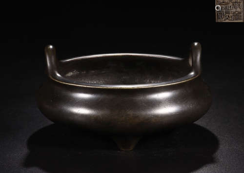 A BRONZE TRIPOD CENSER