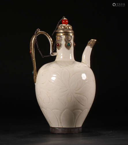 A DING HANDLED POT WITH GILT SILVER