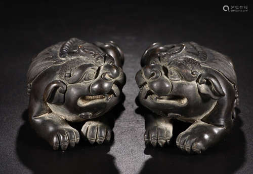 A PAIR OF BRONZE LIONS
