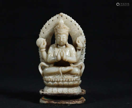 A HETIAN JADE FOUR ARM GUANYIN