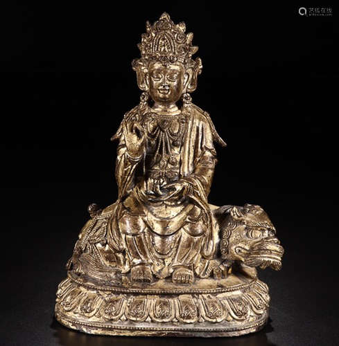 A GILT BRONZE LION AND GUANYIN