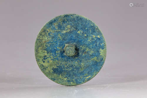 A Chinese bronze inscribed knob mirror