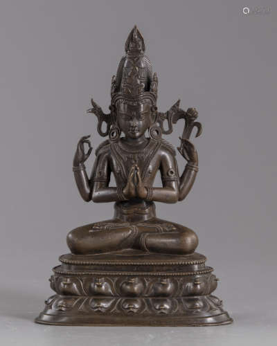 A Sino-tibetan four armed bronze figure