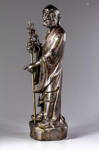 A gilt Chinese bronze figure of a Luohan