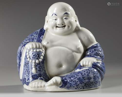 A Chinese blue and white figure of Budai
