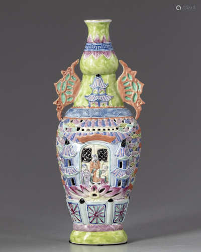 A Chinese famille rose moulded and reticulated ‘Three Star Gods’ vase