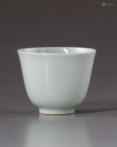 A small Chinese white-glazed anhua decorated ‘dragon’ cup