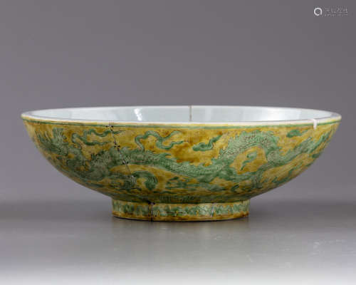 A large Chinese yellow-ground green decorated 'dragon' bowl
