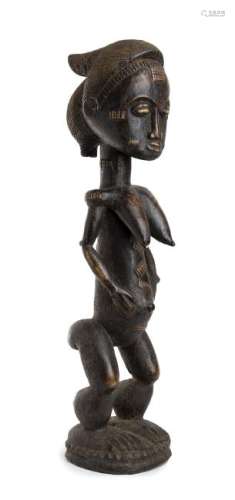 A WOOD FEMALE FIGURE Ivory Coast, Baule  67 cm high