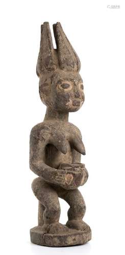 A WOOD WITH TRACES OF POLYCHROMY FEMALE FIGURE Nigeria,