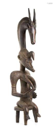 A WOOD FEMALE FIGURE WITH ANTELOPE FINIAL Senufo  95 cm