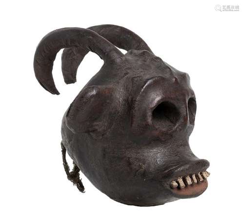 A WOOD AND LEATHER SCULPTURE OF AN ANIMAL HEAD Nigeria,