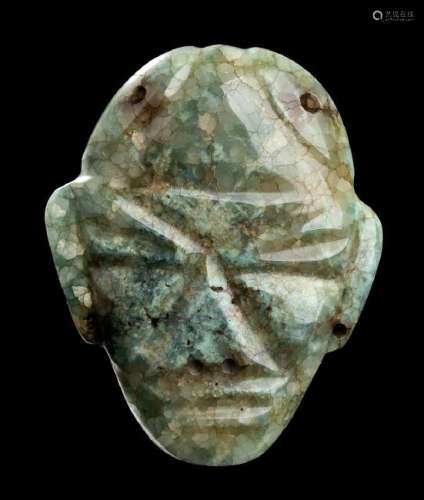 A GREEN JADE MASK Olmec style  11 cm high  Provenance: