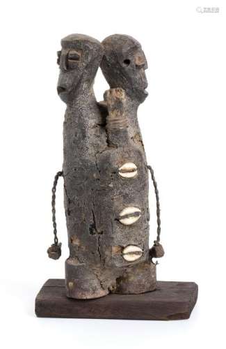 A WOOD, GLASS BOTTLES AND COWRIE SHELLS TWO-FIGURES