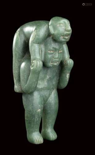 A GREEN JADE SCULPTURE OF TWO FIGURES Olmec style  23,5