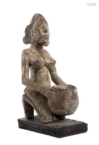 A WOOD SEATED FEMALE FIGURE Senufo  50 cm high