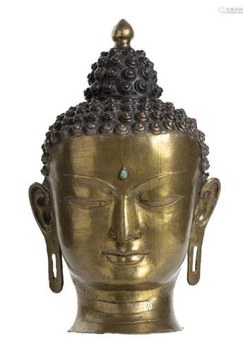 A GILT BRONZE BUDDHA HEAD Tibet, 20th century  43 cm